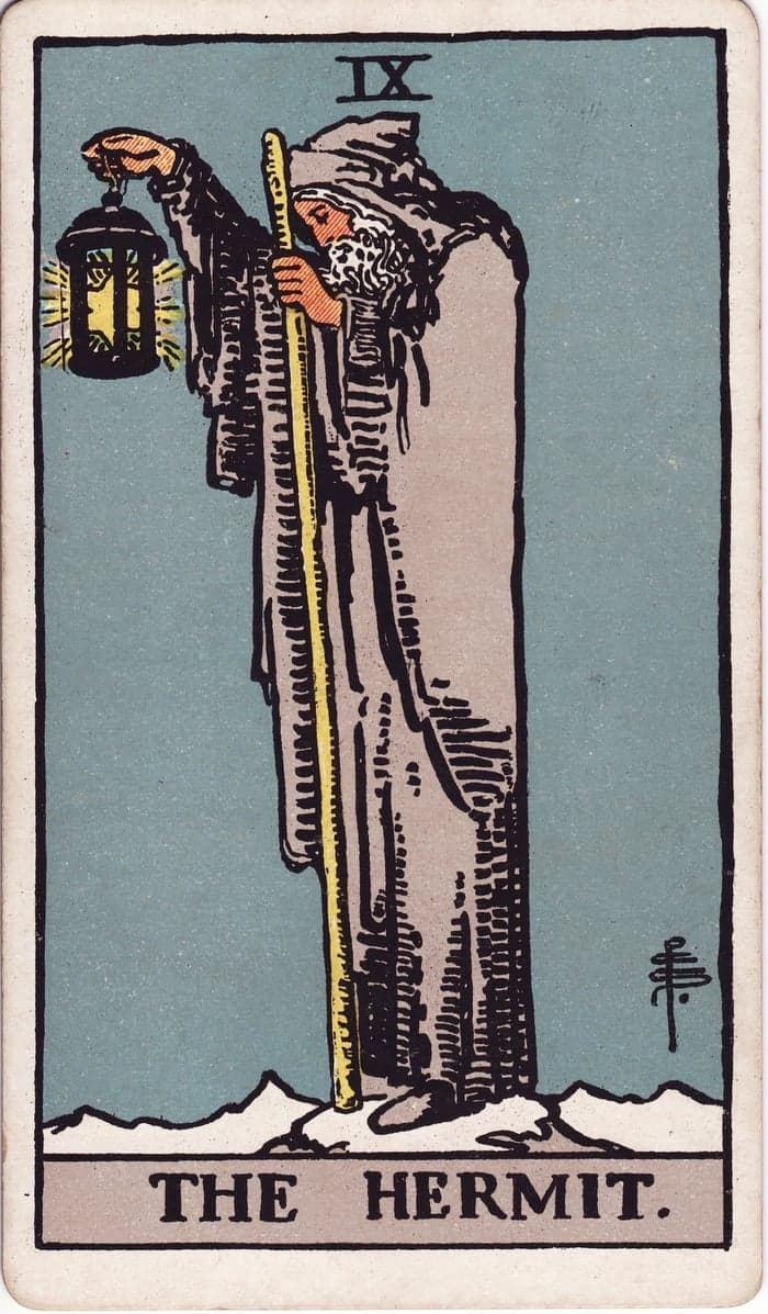 The Hermit, Waite–Smith 1909: a robed figure on a peak holding a raised, star-lit lantern.